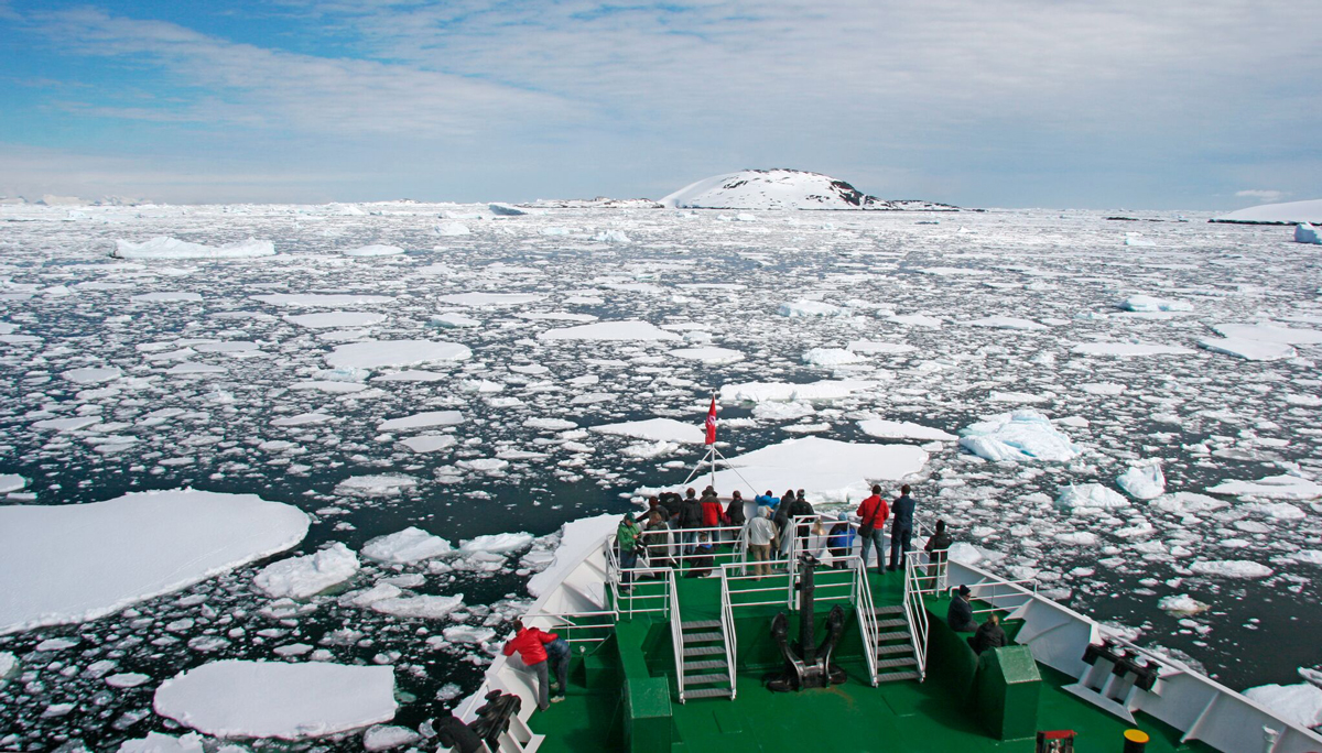 Lots of people on deck aboard an antarctic cruise vessel
